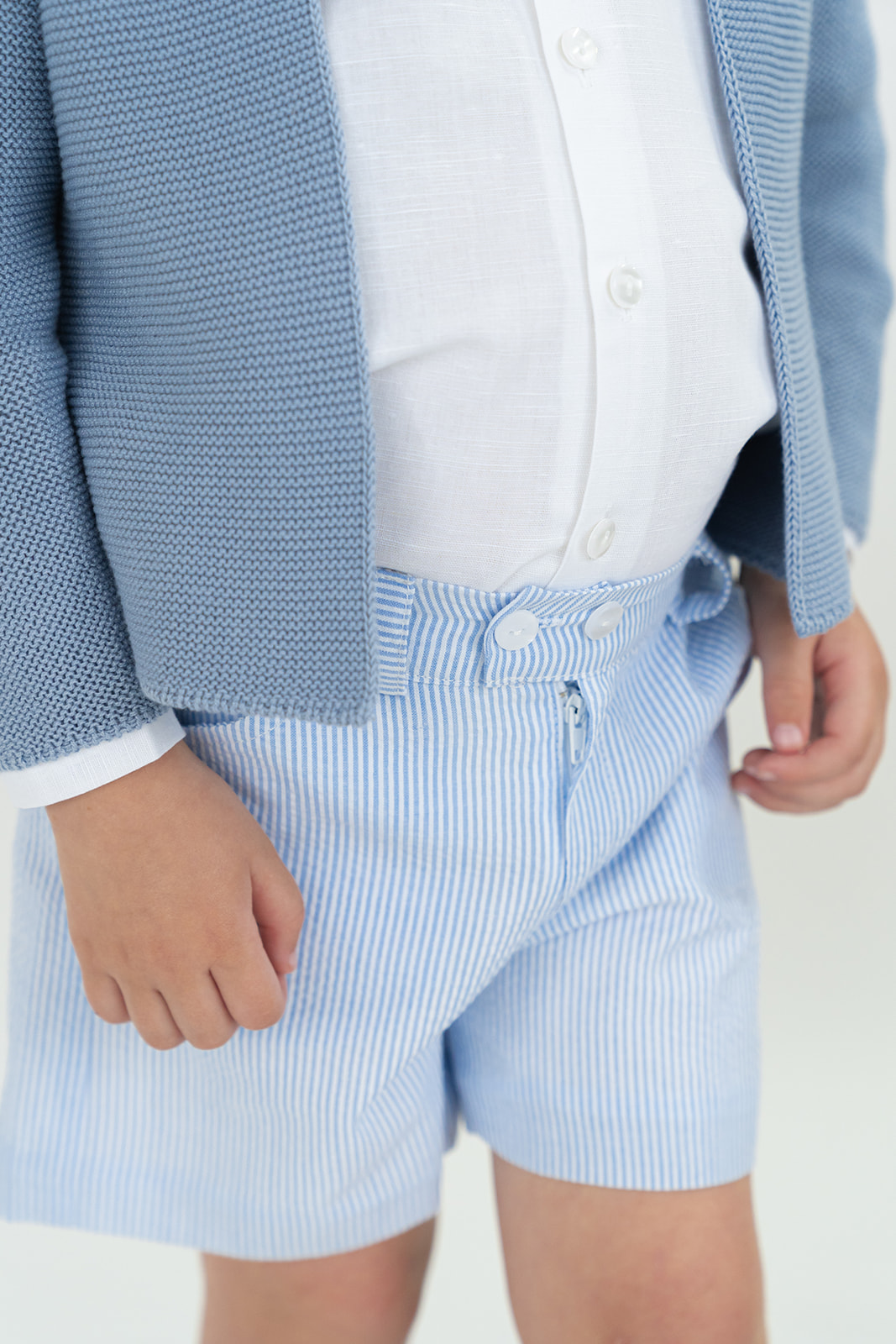 Chaqueta larga en punto perlé dos botones azul